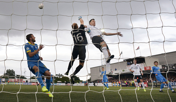 Sergei Chernikof BATE Borisov (L) punches clear from Brian Gartland (R) of Dundalk during the Champions League 2nd round qualifying game at Oriel Park on July 22, 2015 in Dundalk, Ireland. (Photo by Charles McQuillan/Getty Images)