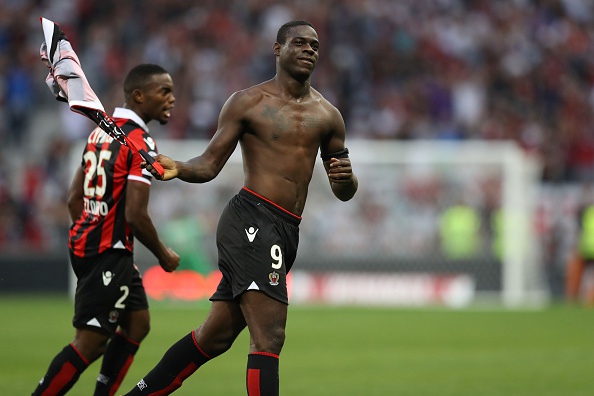 Nice's Italian forward Mario Balotelli (R) celebrates after scoring a goal with his teammate French midfielder Wylan Cyprien during the French L1 football match Nice (OGCN) vs Lorient (FCL) on October 2, 2016 at the "Allianz Riviera" stadium in Nice, southeastern France. / AFP / VALERY HACHE (Photo credit should read VALERY HACHE/AFP/Getty Images)