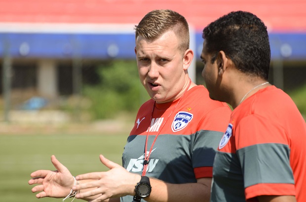 Bengaluru FC's Performance Analyst and Head of Youth Development Matt Holland (L) in conversation with Head of Sports Sciences Donavan Pillai at the Bangalore Football Stadium, in Bengaluru.