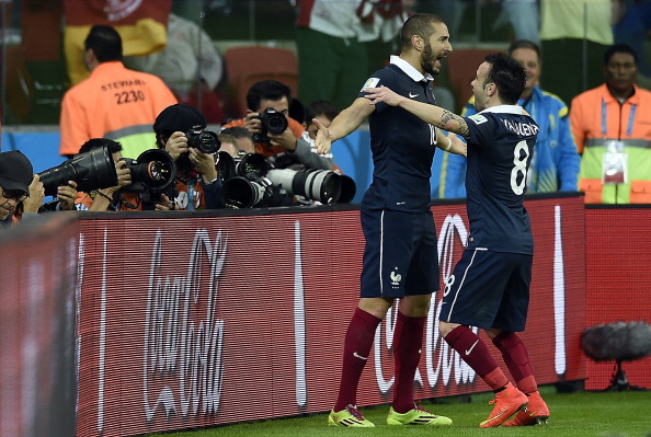 France's forward Karim Benzema (L) celebrates with teammate midfielder Mathieu Valbuena after scoring during the Group E football match between France and Honduras at the Beira-Rio Stadium in Porto Alegre on June 15, 2014, during the 2014 FIFA World Cup. AFP PHOTO / FRANCK FIFE (Photo credit should read FRANCK FIFE/AFP/Getty Images)