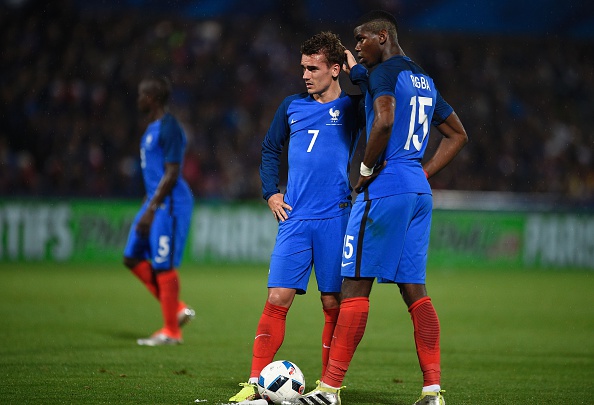 France's forward Antoine Griezmann (L) and France's midfielder Paul Pogba (R) react during the friendly football match between France and Scotland, at the Saint Symphorien Stadium in Metz, eastern France, on June 4, 2016, in preparation of the UEFA Euro 2016. France defeated Scotland 3-0. / AFP / JEAN-CHRISTOPHE VERHAEGEN (Photo credit should read JEAN-CHRISTOPHE VERHAEGEN/AFP/Getty Images)