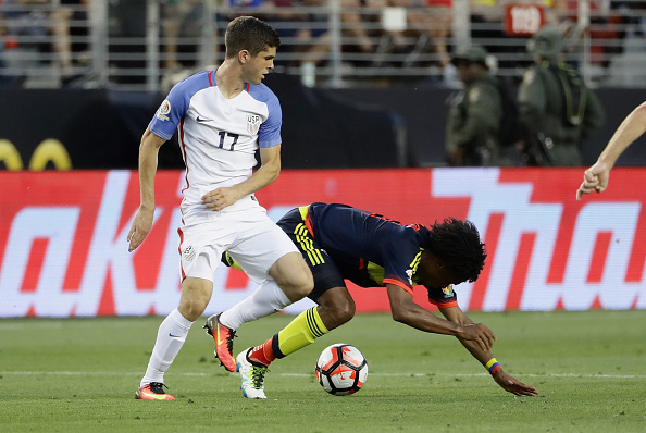 Christian Pulisic #17 of United States collides with Juan Cuadrado #11 of Colombia during the 2016 Copa America Centenario Group match between the United States and Colombia at Levi's Stadium on June 3, 2016 in Santa Clara, California.