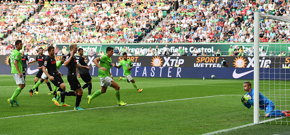 Sven Muller saves a shot from Mario Gomez in his Bundesliga debut. Stuart Franklin / Bongarts / Getty Images