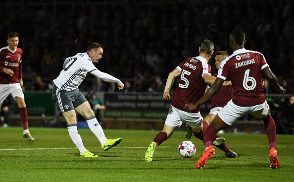 NORTHAMPTON, ENGLAND - SEPTEMBER 21: Wayne Rooney of Manchester United shoots on goal during the EFL Cup Third Round match between Northampton Town and Manchester United at Sixfields on September 21, 2016 in Northampton, England. (Photo by Shaun Botterill/Getty Images)