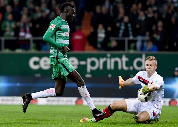 BREMEN, GERMANY - OCTOBER 15: Ousman Manneh (L) of Bremen fails to score over Bernd Leno, goalkeeper (R) of Leverkusen during the Bundesliga match between Werder Bremen and Bayer 04 Leverkusen at Weserstadion on October 15, 2016 in Bremen, Germany. (Photo by Stuart Franklin/Bongarts/Getty Images)