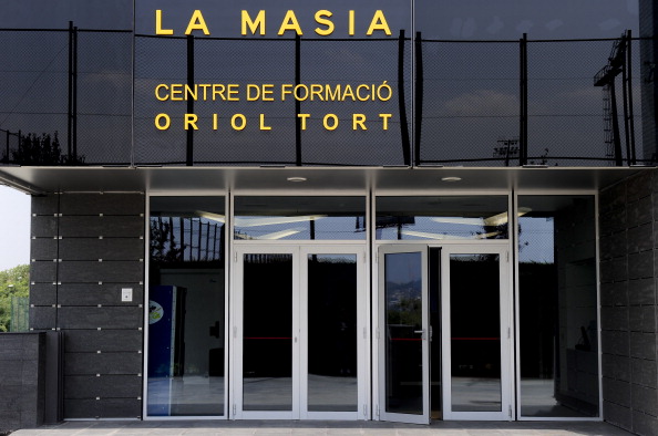 Entry of the new building named "La Masia" of the training centre Oriol Tort where young players of the Barcelona football club live and train, near the Camp Nou stadium in Barcelona on August 5, 2011 . AFP PHOTO/ JOSEP LAGO 