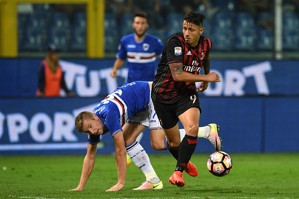 GENOA, ITALY - SEPTEMBER 16: Milan Skriniar (L) of UC Sampdoria is tackled by Gianluca Lapadula of AC Milan during the Serie A match between UC Sampdoria and AC Milan at Stadio Luigi Ferraris on September 16, 2016 in Genoa, Italy. (Photo by Valerio Pennicino/Getty Images)